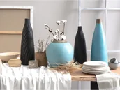 Poduszki ogrodowe - Beliani Wazon dekoracyjny czarny 54 cm FLORENTIA - miniaturka - grafika 1