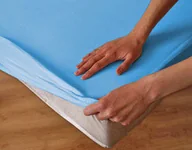 Prześcieradła - Darymex Nieprzemakalne prześcieradło jersey z gumką SG niebieskie 140x200 dx-140-sg-15 - miniaturka - grafika 1