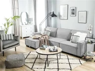 Narożniki - Beliani Sofa narożna prawostronna z funkcją spania jasnoszara ROMEDAL - miniaturka - grafika 1