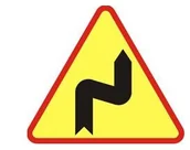 Wyposażenie miejsc publicznych - Znak ostrzegawczy A-3 dwa niebezpieczne zakręty - pierwszy w prawo - miniaturka - grafika 1